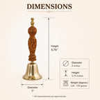 A dimension diagram of a decorative brass bell with a carved brown wooden handle, showing measurements for height, diameter, and weight on a light beige background.