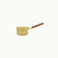 Brass saucepan with a wooden handle, shown against a plain off-white background.